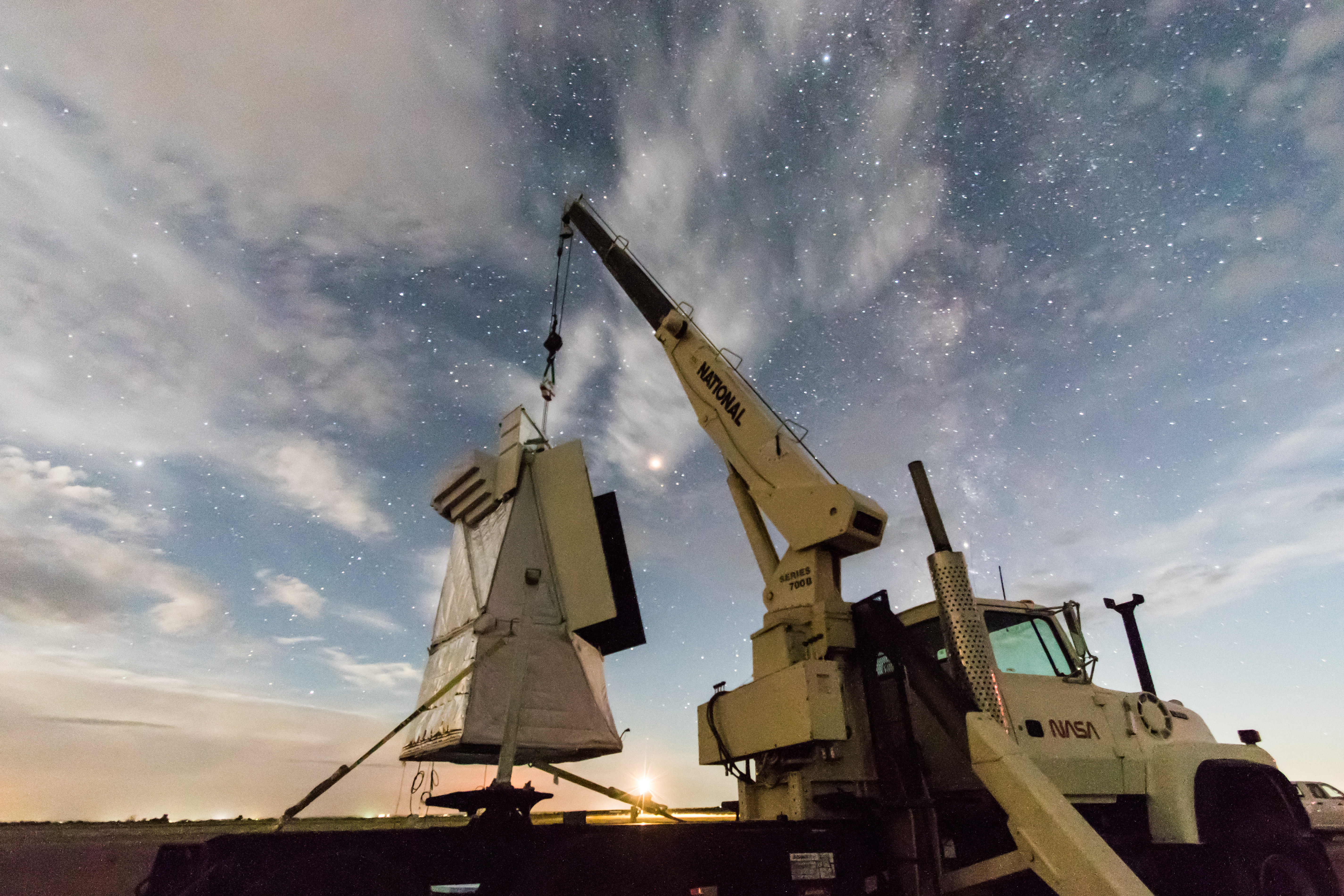 FIREBALL gondola being lifted by NASA crane at night